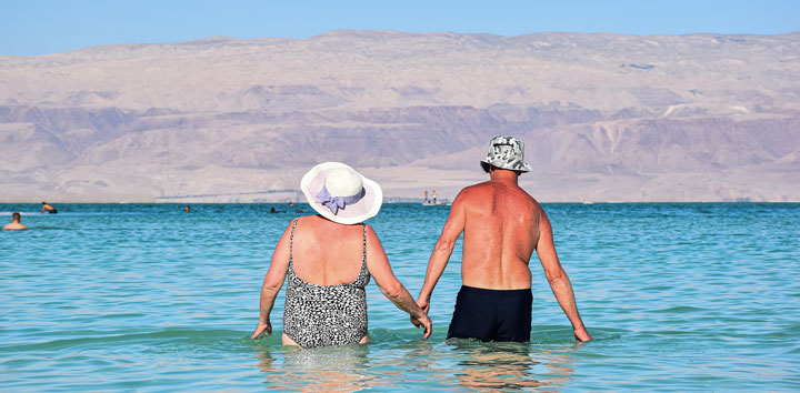 retired couple going for swimming